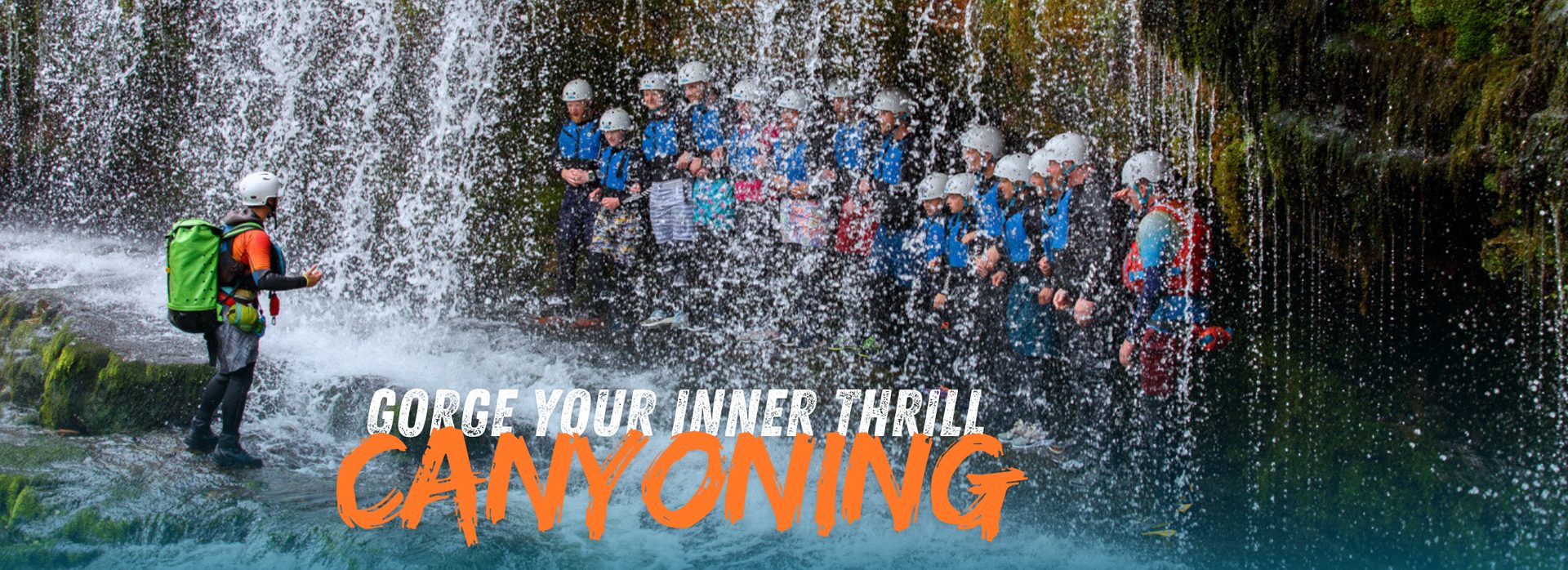 Canyoning through a waterfall in the Brecon Beacons